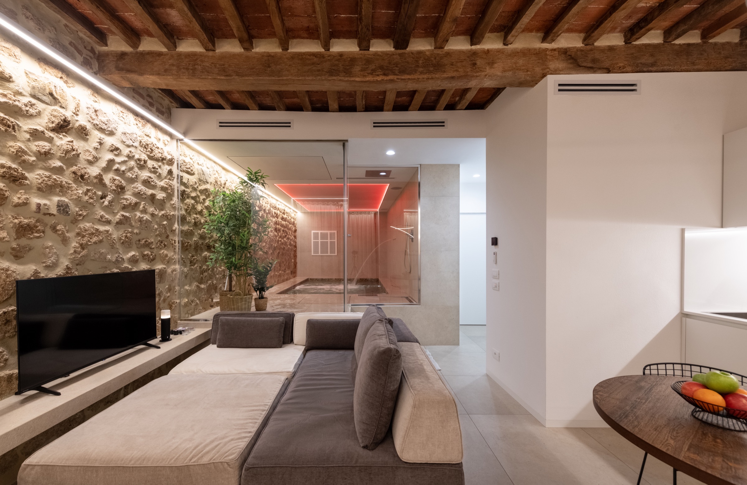 Stone living area at Loft SPA Massa Marittima